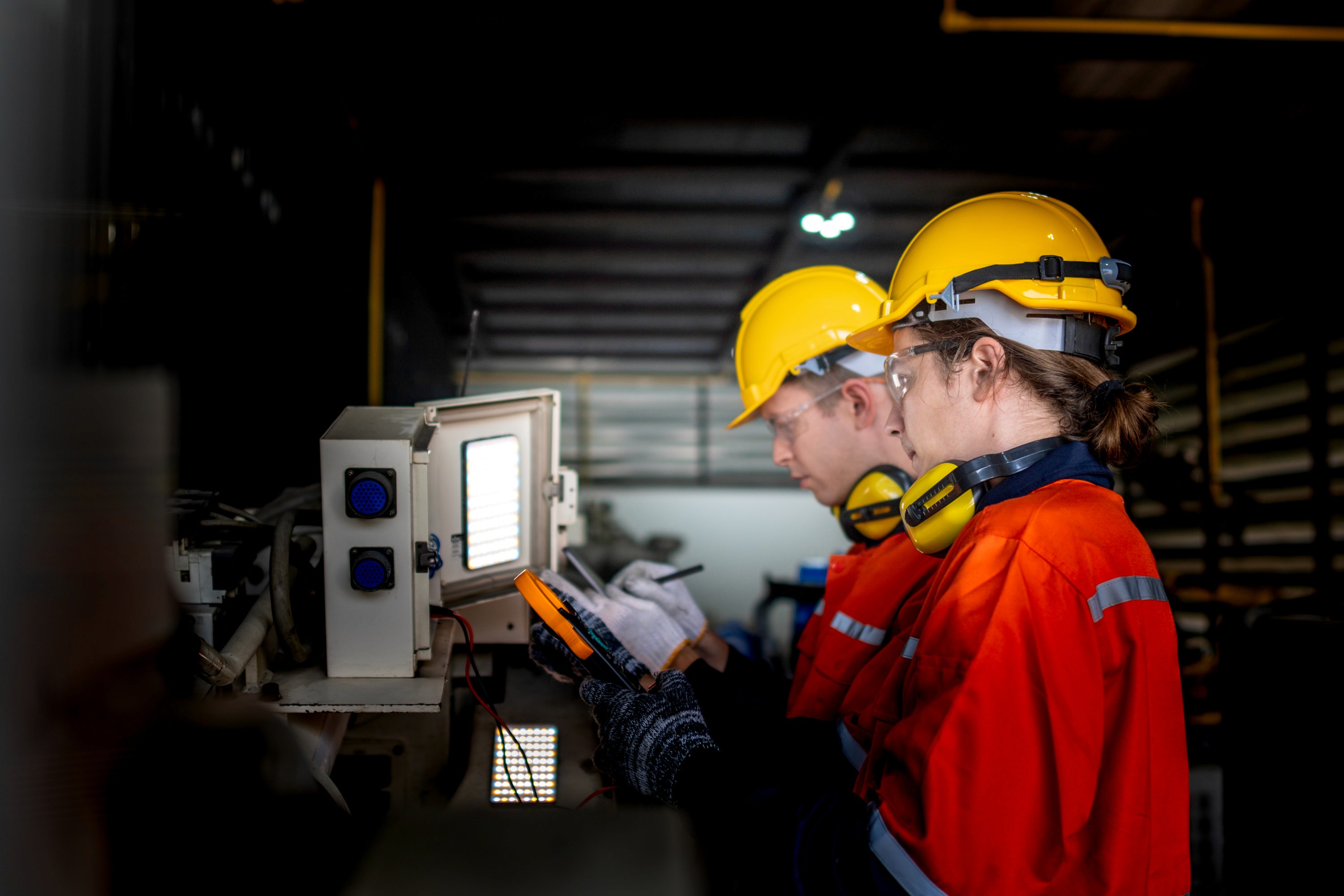 Isobex engineers inspecting a laser system